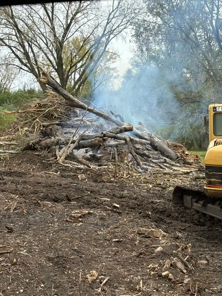 Machine near a burning log